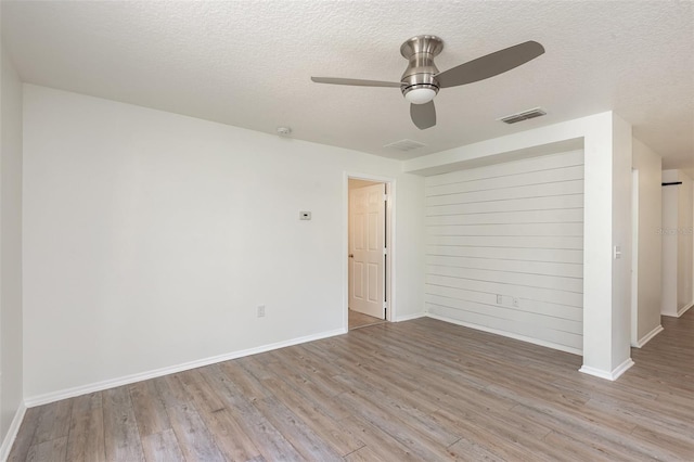 85 Levee Ln, Ormond Beach, FL 32174 - spare room with a textured ceiling, wood finished floors, and a ceiling fan