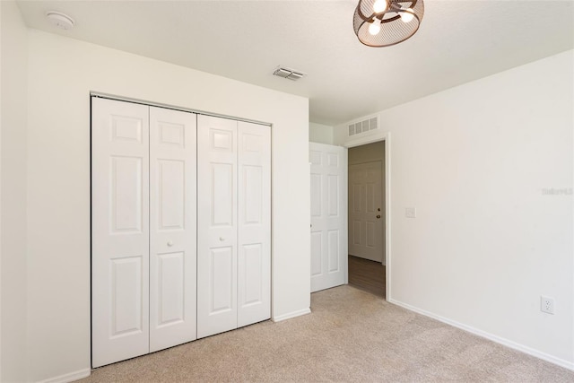 85 Levee Ln, Ormond Beach, FL 32174 - unfurnished bedroom with light carpet and a closet