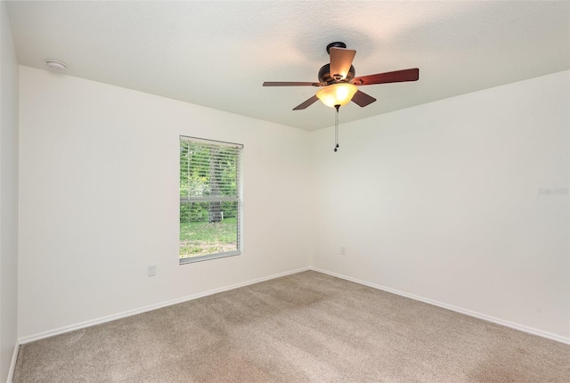85 Levee Ln, Ormond Beach, FL 32174 - unfurnished room with light colored carpet, a smoke detector, and a ceiling fan