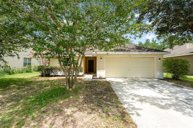 85 Levee Ln, Ormond Beach, FL 32174 - view of front facade featuring an attached garage, concrete driveway, and stucco siding