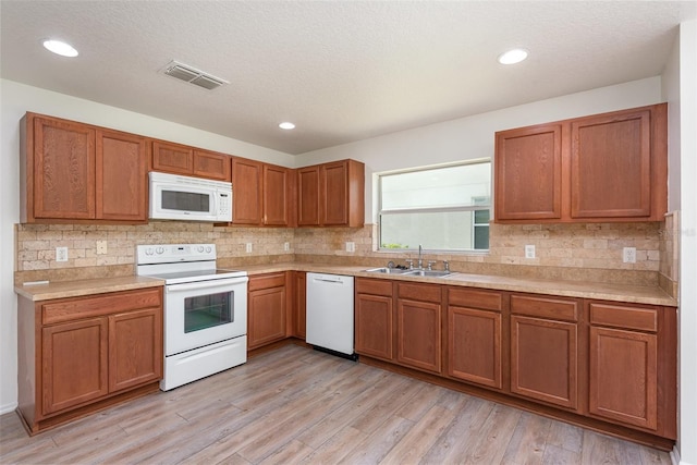 85 Levee Ln, Ormond Beach, FL 32174 - kitchen with white appliances, light countertops, tasteful backsplash, and recessed lighting