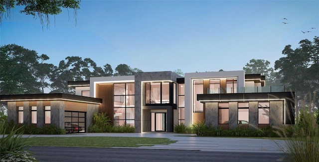 7011 Via Carmel Way, Orlando, FL 32819 - modern home featuring an attached garage and stucco siding