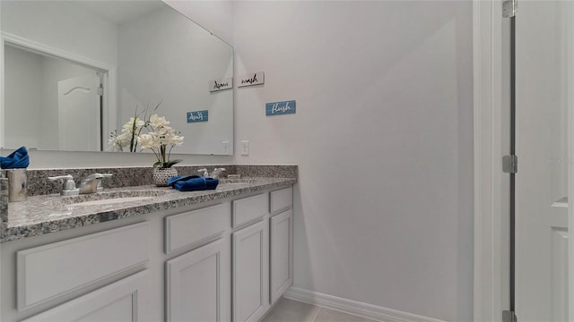 33608 Seattle Slew Dr, Sorrento, FL 32776 - bathroom featuring double vanity and tile patterned flooring