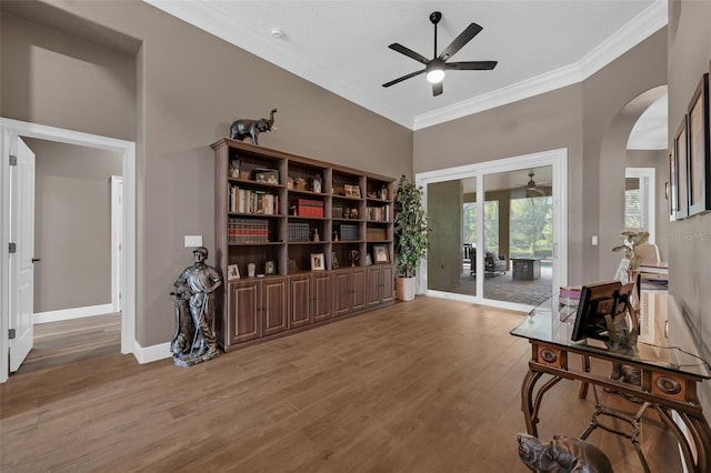 1462 Palm Bay Ct, Lake Mary, FL 32746 - living area featuring ceiling fan, crown molding, arched walkways, and light wood-type flooring