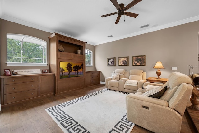 1462 Palm Bay Ct, Lake Mary, FL 32746 - living area with wood finished floors, ceiling fan, and crown molding