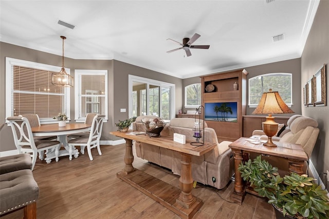 1462 Palm Bay Ct, Lake Mary, FL 32746 - living area featuring a ceiling fan, light wood-style floors, plenty of natural light, and ornamental molding