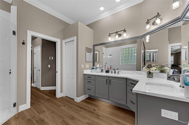 1462 Palm Bay Ct, Lake Mary, FL 32746 - full bath with double vanity, crown molding, a shower stall, and wood finished floors
