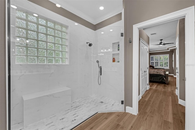 1462 Palm Bay Ct, Lake Mary, FL 32746 - full bathroom featuring connected bathroom, crown molding, a marble finish shower, wood finished floors, and ceiling fan
