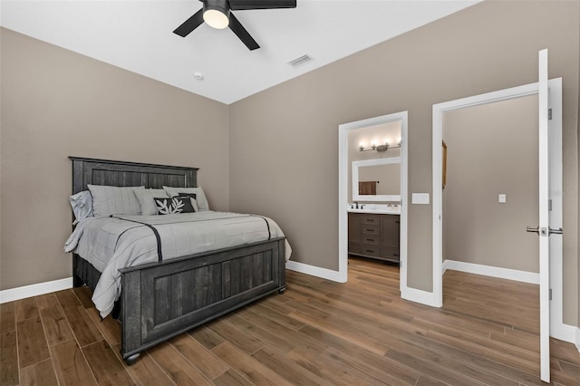 1462 Palm Bay Ct, Lake Mary, FL 32746 - bedroom with wood finished floors, a ceiling fan, and connected bathroom