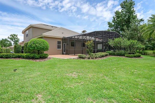 1462 Palm Bay Ct, Lake Mary, FL 32746 - back of house featuring a patio, a lawn, stucco siding, and a lanai