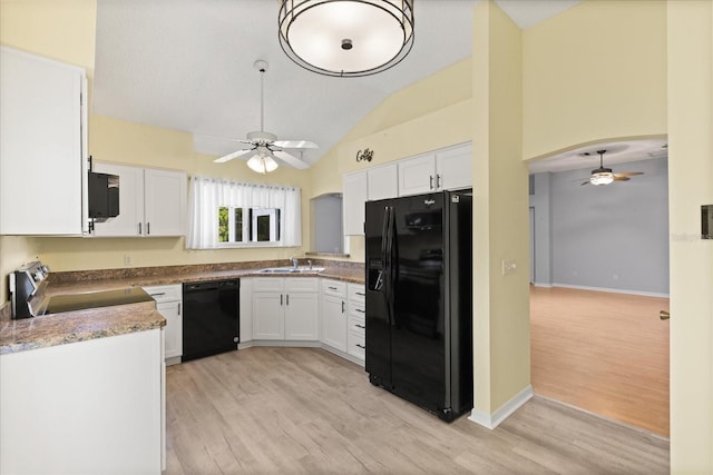 956 Chula Ct, Lady Lake, FL 32159 - kitchen featuring black appliances, ceiling fan, lofted ceiling, light wood-style floors, and white cabinets