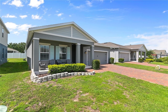 410 Winter Bliss Ln, Mount Dora, FL 32757 - view of front of home with a porch, an attached garage, stucco siding, and decorative driveway