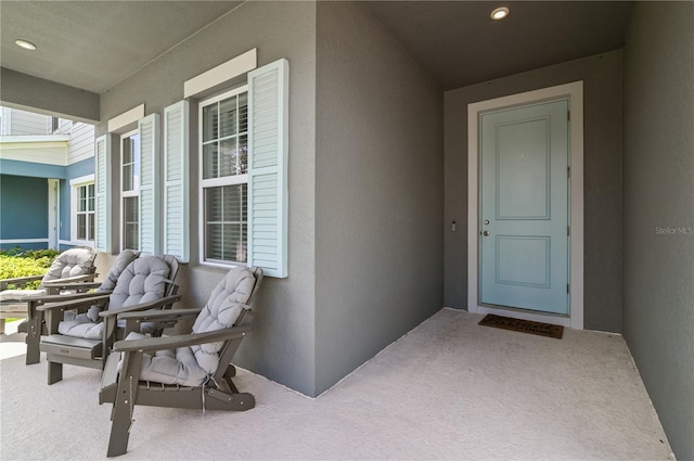 410 Winter Bliss Ln, Mount Dora, FL 32757 - property entrance with stucco siding and covered porch