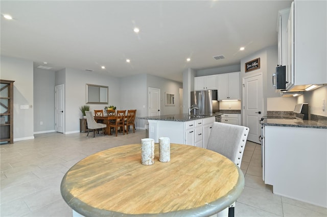 410 Winter Bliss Ln, Mount Dora, FL 32757 - dining space featuring light tile patterned floors and recessed lighting