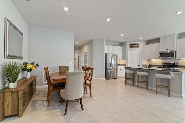 410 Winter Bliss Ln, Mount Dora, FL 32757 - dining area with recessed lighting and light tile patterned floors