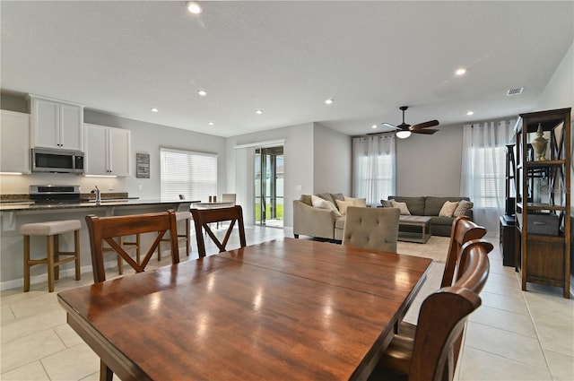 410 Winter Bliss Ln, Mount Dora, FL 32757 - dining space with light tile patterned floors, a ceiling fan, and recessed lighting