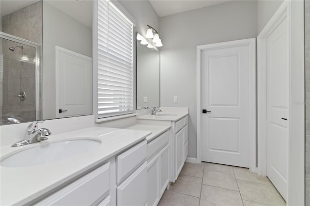 410 Winter Bliss Ln, Mount Dora, FL 32757 - full bathroom with a stall shower, double vanity, and tile patterned floors