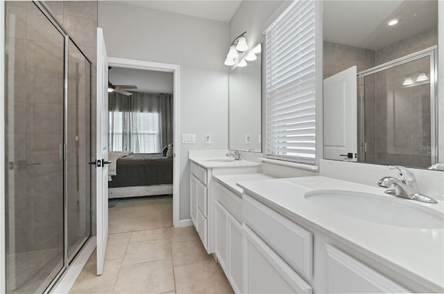 410 Winter Bliss Ln, Mount Dora, FL 32757 - bathroom featuring double vanity, healthy amount of natural light, a stall shower, tile patterned flooring, and recessed lighting