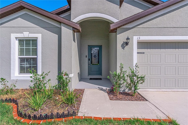 13 Ryken Ln, Palm Coast, FL 32164 - property entrance with stucco siding and an attached garage