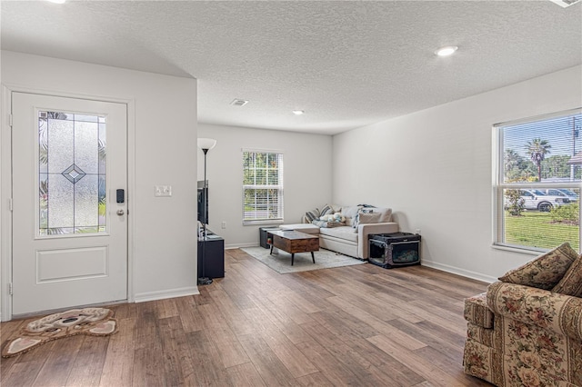 13 Ryken Ln, Palm Coast, FL 32164 - foyer entrance featuring a textured ceiling, light wood-type flooring, and recessed lighting