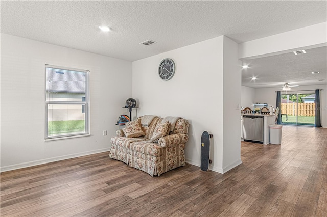 13 Ryken Ln, Palm Coast, FL 32164 - living area with a textured ceiling, wood finished floors, and ceiling fan