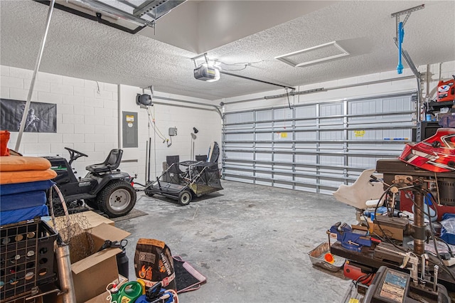 13 Ryken Ln, Palm Coast, FL 32164 - garage featuring electric panel, a garage door opener, and concrete block wall