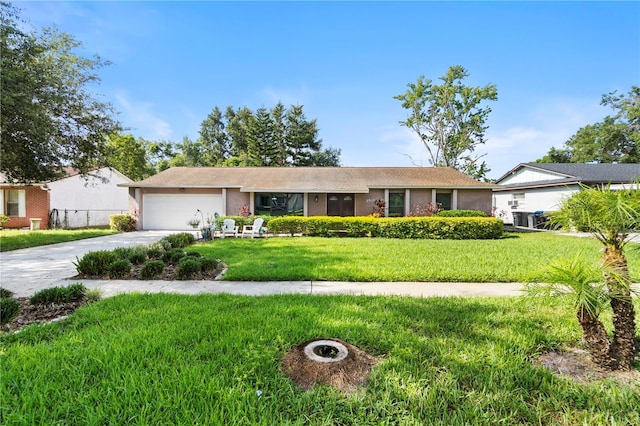 7022 Talbot Dr, Orlando, FL 32819 - ranch-style house with a garage, a front yard, driveway, and stucco siding