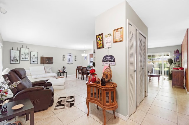 7022 Talbot Dr, Orlando, FL 32819 - living area with light tile patterned flooring and a chandelier