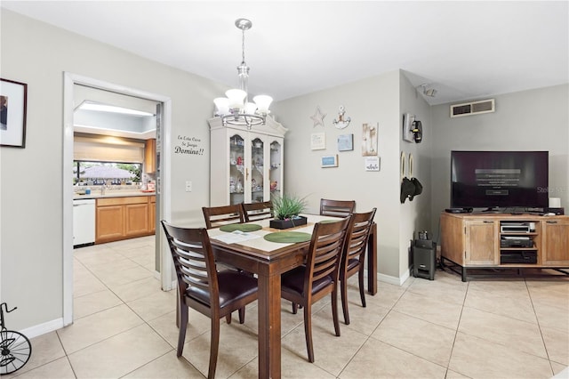 7022 Talbot Dr, Orlando, FL 32819 - dining space featuring a chandelier and light tile patterned floors