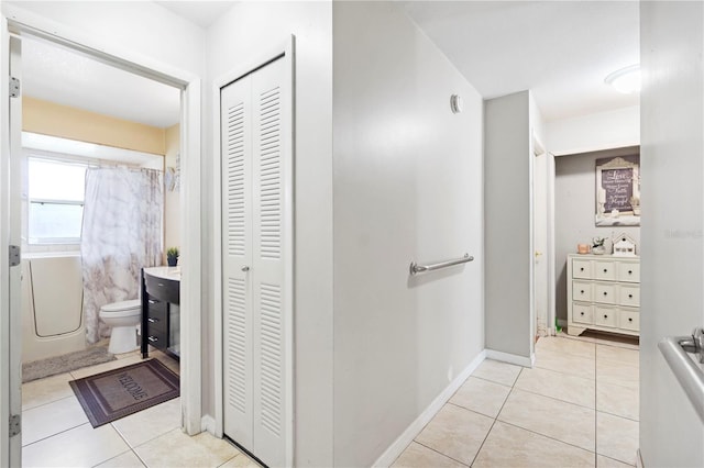 7022 Talbot Dr, Orlando, FL 32819 - bathroom with a closet, tile patterned floors, and vanity