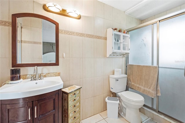 7022 Talbot Dr, Orlando, FL 32819 - bathroom with a shower stall, vanity, tile walls, and tile patterned flooring