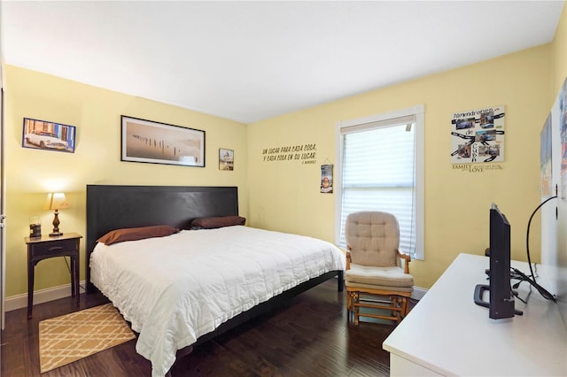 7022 Talbot Dr, Orlando, FL 32819 - bedroom featuring dark wood-style floors and baseboards