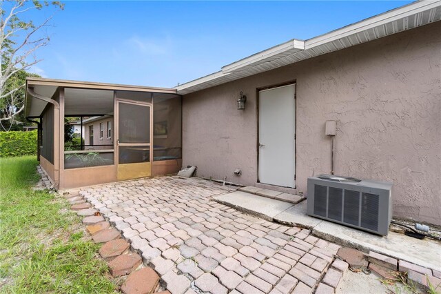 7022 Talbot Dr, Orlando, FL 32819 - view of patio with a sunroom