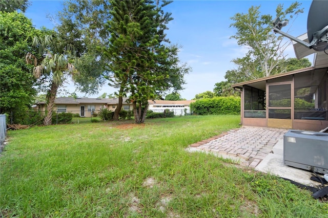 7022 Talbot Dr, Orlando, FL 32819 - view of yard featuring a sunroom and a patio area