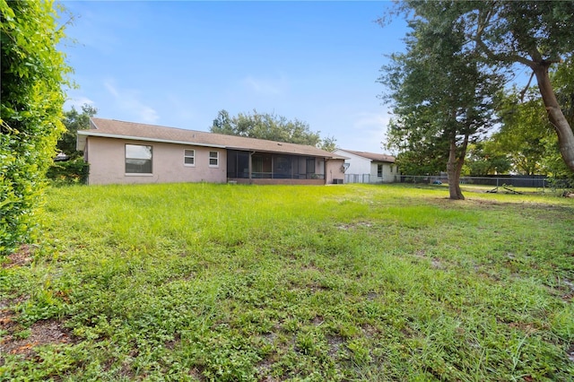 7022 Talbot Dr, Orlando, FL 32819 - rear view of house with a sunroom and stucco siding