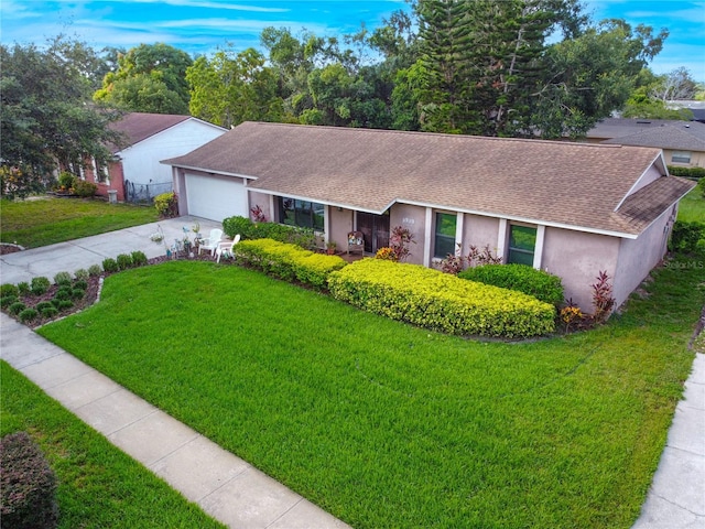 7022 Talbot Dr, Orlando, FL 32819 - single story home with roof with shingles, concrete driveway, stucco siding, and a front lawn