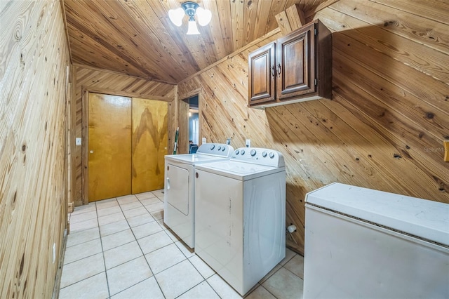 2005 SW Driftwood St, Port St Lucie, FL 34953 - washroom with separate washer and dryer, cabinet space, wood walls, light tile patterned flooring, and wooden ceiling