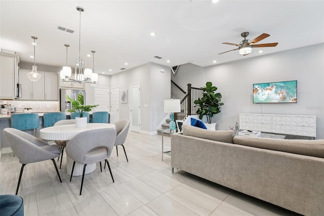 10009 Randal Walk St, Orlando, FL 32832 - living room featuring stairway, a ceiling fan, recessed lighting, and a chandelier