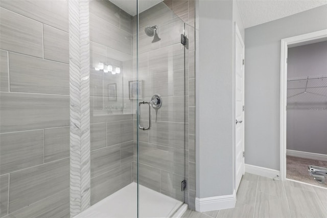 10009 Randal Walk St, Orlando, FL 32832 - bathroom featuring a stall shower and a spacious closet
