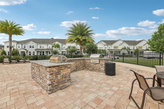 10009 Randal Walk St, Orlando, FL 32832 - view of patio / terrace with a residential view and area for grilling