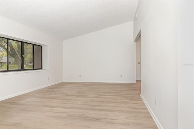 1424 Mt Laurel Dr, Winter Springs, FL 32708 - empty room with light wood finished floors and a textured ceiling