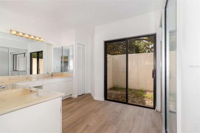 1424 Mt Laurel Dr, Winter Springs, FL 32708 - full bath featuring vanity, wood finished floors, and healthy amount of natural light