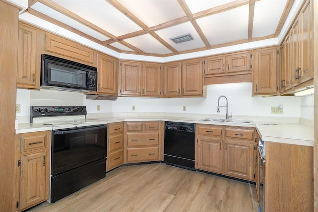 1424 Mt Laurel Dr, Winter Springs, FL 32708 - kitchen featuring black appliances, light wood-style floors, light countertops, and light brown cabinets