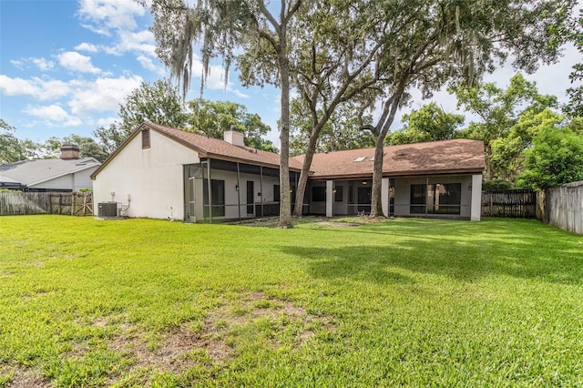 1424 Mt Laurel Dr, Winter Springs, FL 32708 - rear view of house featuring a fenced backyard, a sunroom, and a chimney