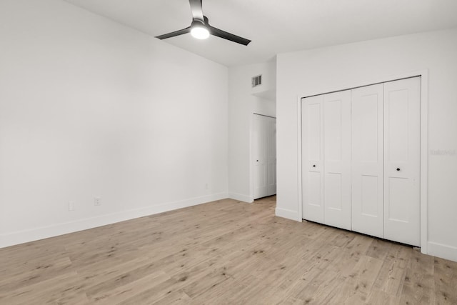 745 Ashley Ln, Orlando, FL 32825 - unfurnished bedroom featuring light wood-type flooring, ceiling fan, and multiple closets