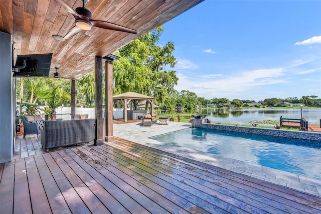 7801 Georgeann St, Winter Park, FL 32792 - wooden deck featuring a gazebo, a water view, a ceiling fan, an outdoor pool, and an outdoor living space