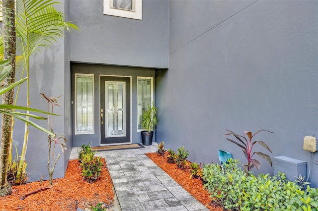 7801 Georgeann St, Winter Park, FL 32792 - entrance to property featuring stucco siding