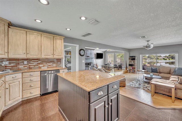 7801 Georgeann St, Winter Park, FL 32792 - kitchen with dishwasher, open floor plan, a kitchen island, light brown cabinets, and recessed lighting