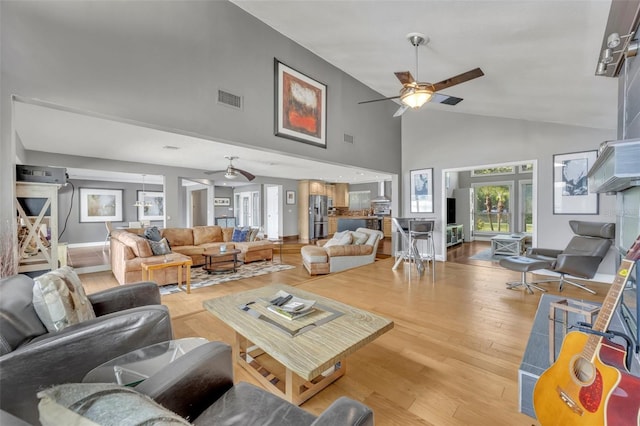 7801 Georgeann St, Winter Park, FL 32792 - living room featuring a ceiling fan, high vaulted ceiling, and wood finished floors