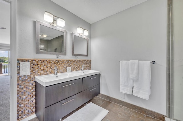 7801 Georgeann St, Winter Park, FL 32792 - full bathroom featuring double vanity and stone tile flooring